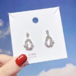 Aretes de Mariposa y Flor con Brillitos