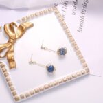 Aretes Dorados con Perla Blanca