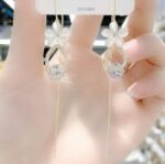 Aretes Largos con flor y joyas brillantes 4867756894531